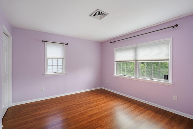 149 King St Unit 15, Chappaqua, NY 10514 - spare room with plenty of natural light, wood finished floors, and baseboards