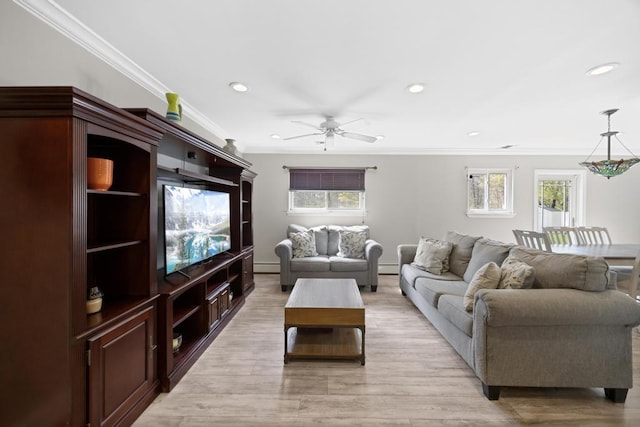 living room with crown molding, ceiling fan, recessed lighting, and light wood-style flooring