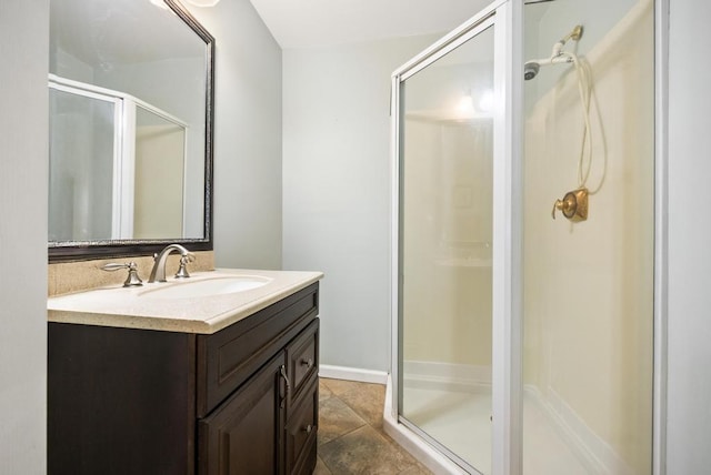 bathroom featuring vanity and a stall shower