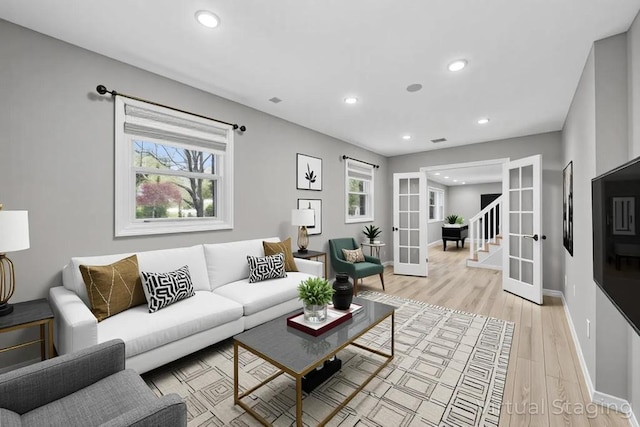 4 Ficus St, Port Jefferson Station, NY 11776 - living area with french doors, baseboards, light wood-style floors, and recessed lighting