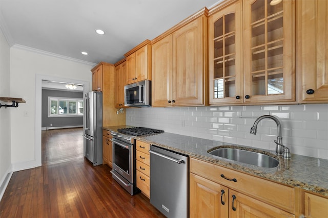 15 Elmore Ave, Croton-On-Hudson, NY 10520 - kitchen with dark stone countertops, a sink, stainless steel appliances, ornamental molding, and dark wood-style floors