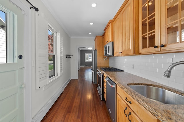 15 Elmore Ave, Croton-On-Hudson, NY 10520 - kitchen with a sink, dark stone counters, ornamental molding, backsplash, and appliances with stainless steel finishes