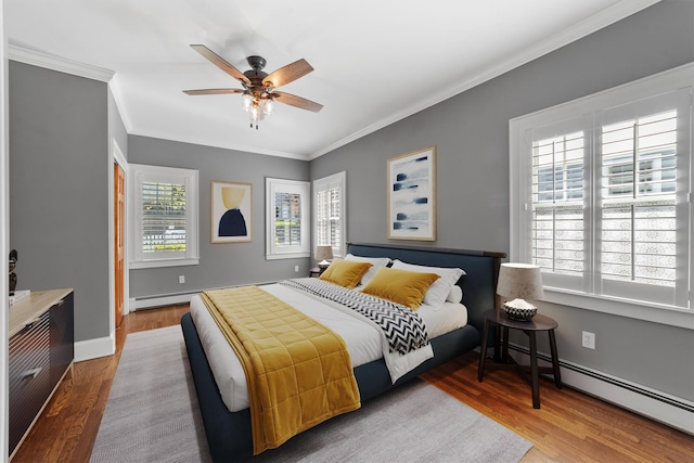 15 Elmore Ave, Croton-On-Hudson, NY 10520 - bedroom featuring a baseboard radiator, baseboards, ornamental molding, ceiling fan, and wood finished floors