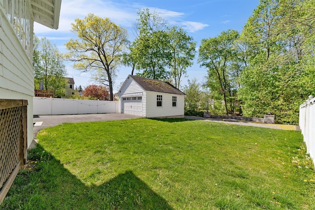 15 Elmore Ave, Croton-On-Hudson, NY 10520 - view of yard featuring fence, a detached garage, and an outdoor structure