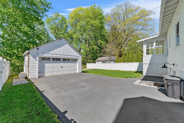 15 Elmore Ave, Croton-On-Hudson, NY 10520 - exterior space with fence, a garage, and an outbuilding