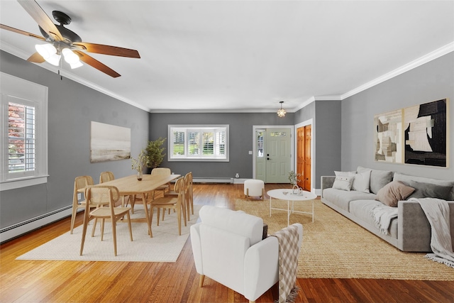 15 Elmore Ave, Croton-On-Hudson, NY 10520 - living room featuring wood finished floors, crown molding, baseboard heating, and a ceiling fan