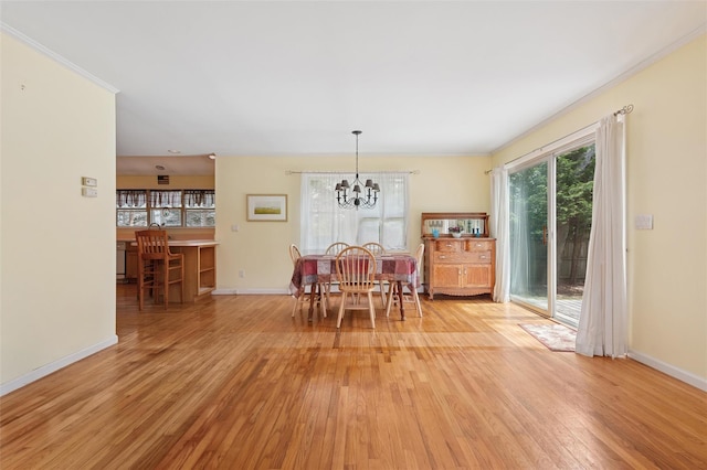 2 Heather Dr, Remsenburg, NY 11960 - dining space with baseboards, light wood-style floors, an inviting chandelier, and plenty of natural light