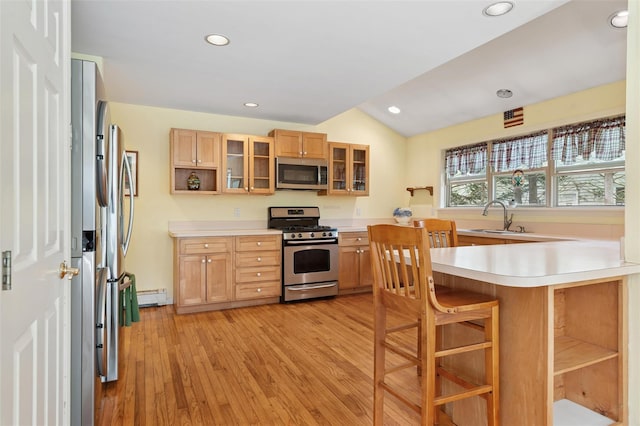 2 Heather Dr, Remsenburg, NY 11960 - kitchen with light wood finished floors, glass insert cabinets, a sink, light countertops, and appliances with stainless steel finishes