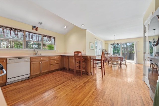 2 Heather Dr, Remsenburg, NY 11960 - kitchen with a wealth of natural light, light wood-type flooring, a sink, and dishwasher