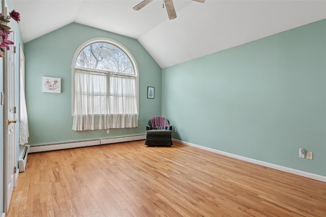 2 Heather Dr, Remsenburg, NY 11960 - unfurnished room with lofted ceiling, a baseboard heating unit, baseboards, ceiling fan, and wood finished floors