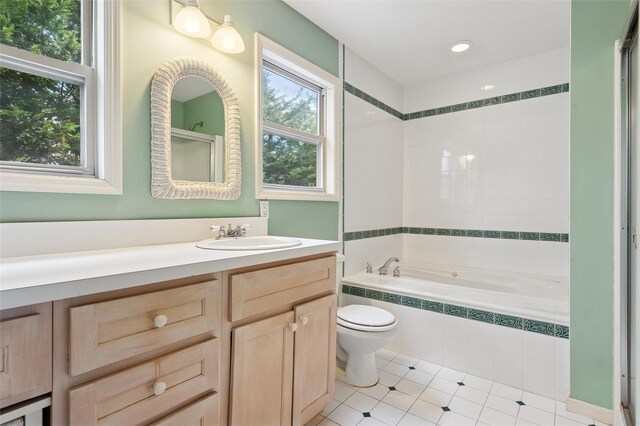2 Heather Dr, Remsenburg, NY 11960 - bathroom featuring walk in shower, toilet, vanity, tile patterned flooring, and tiled tub