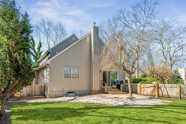2 Heather Dr, Remsenburg, NY 11960 - rear view of property with a chimney, a yard, and fence
