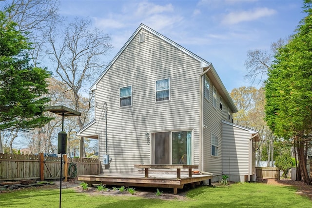 2 Heather Dr, Remsenburg, NY 11960 - rear view of property featuring a yard, fence, and a wooden deck