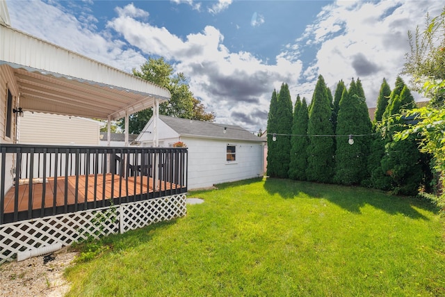 view of yard with a wooden deck