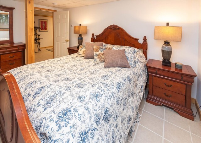 bedroom featuring light tile patterned flooring