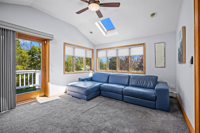 carpeted living area with baseboards, a baseboard radiator, ceiling fan, and vaulted ceiling with skylight
