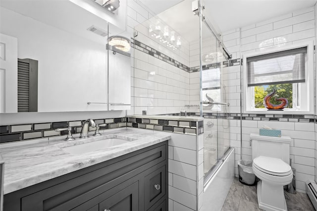 bathroom with toilet, marble finish floor, enclosed tub / shower combo, visible vents, and vanity