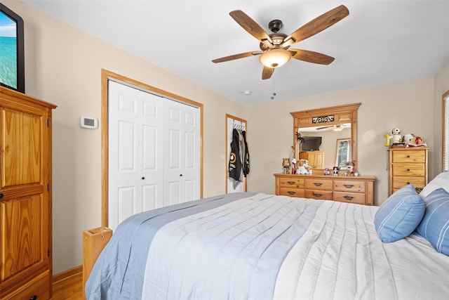 bedroom featuring ceiling fan, baseboards, and light wood-type flooring