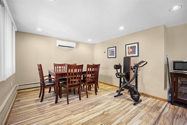 dining area featuring a wall unit AC, baseboards, a baseboard heating unit, light wood-style floors, and recessed lighting