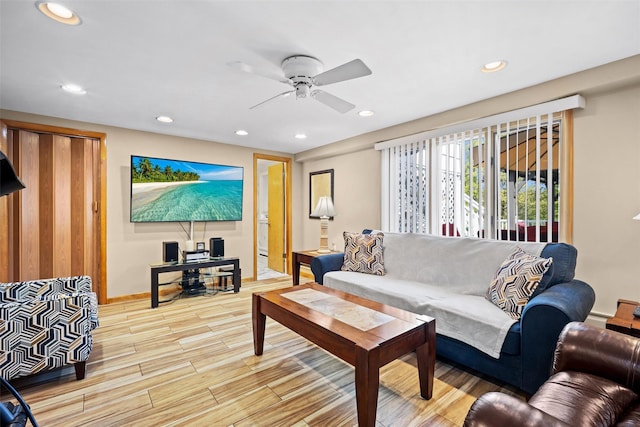 living area with recessed lighting, baseboards, a ceiling fan, and wood finished floors