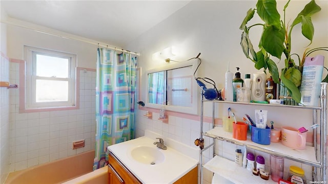 full bathroom with vanity, decorative backsplash, and shower / bath combo with shower curtain