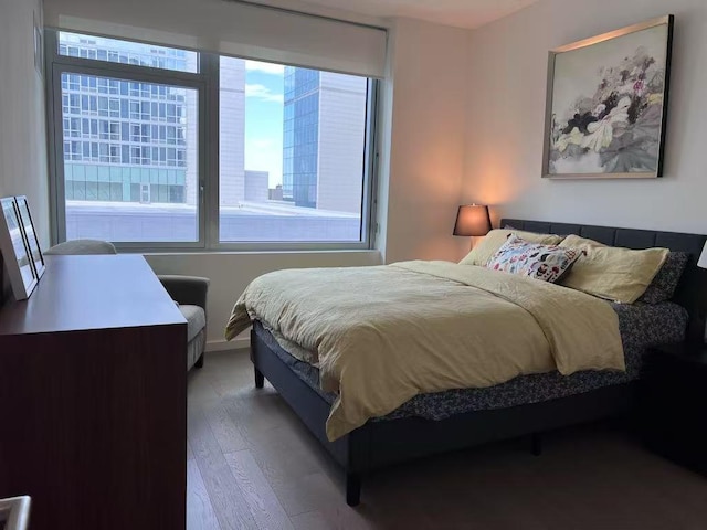 bedroom featuring wood finished floors