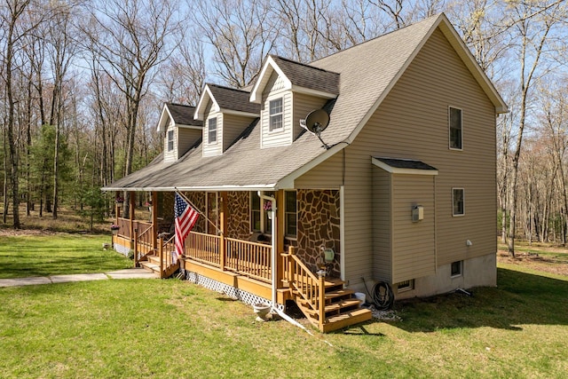 83 Split Rock Dr, Barryville, NY 12719 - view of side of home featuring a porch, a shingled roof, a lawn, and stone siding