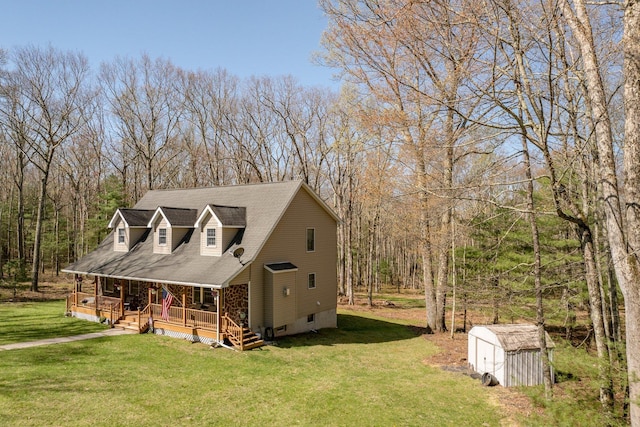 83 Split Rock Dr, Barryville, NY 12719 - view of front of home featuring a front lawn, a storage shed, an outbuilding, covered porch, and a wooded view