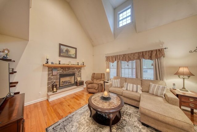 83 Split Rock Dr, Barryville, NY 12719 - living room featuring a fireplace, high vaulted ceiling, baseboards, and hardwood / wood-style floors
