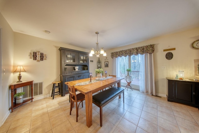 83 Split Rock Dr, Barryville, NY 12719 - dining space with light tile patterned floors, baseboards, visible vents, and a chandelier