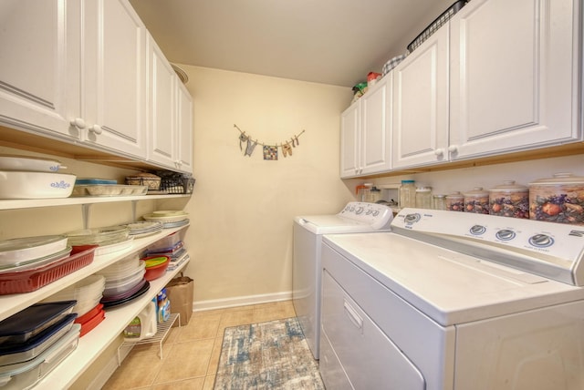 83 Split Rock Dr, Barryville, NY 12719 - laundry area with baseboards, washer and clothes dryer, cabinet space, and light tile patterned floors