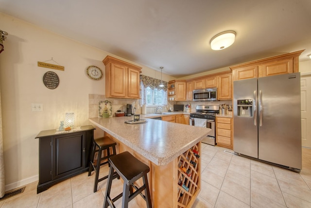 83 Split Rock Dr, Barryville, NY 12719 - kitchen with light tile patterned flooring, light countertops, stainless steel appliances, a peninsula, and visible vents