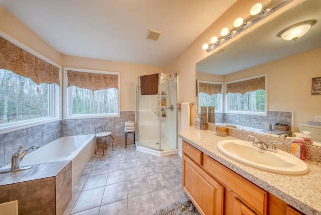 83 Split Rock Dr, Barryville, NY 12719 - full bath featuring visible vents, a garden tub, vanity, tile patterned floors, and a stall shower