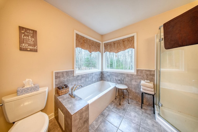 83 Split Rock Dr, Barryville, NY 12719 - bathroom with toilet, tile patterned floors, a bath, and a stall shower