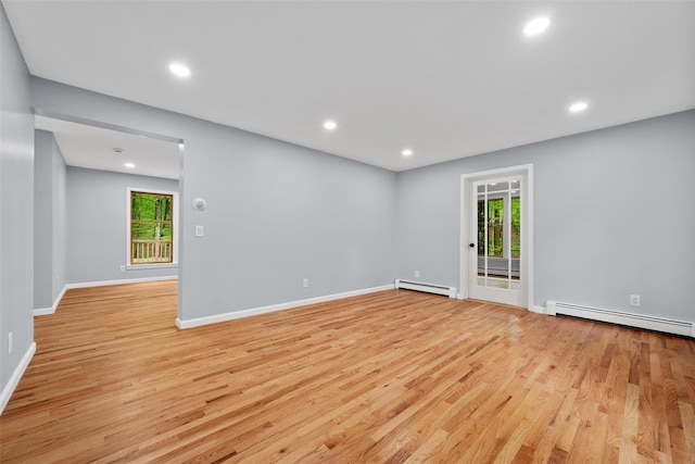 14 Still Hollow Rd, Newburgh, NY 12550 - empty room featuring baseboard heating, light wood finished floors, healthy amount of natural light, and recessed lighting