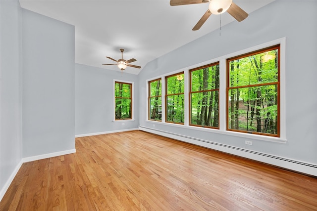 14 Still Hollow Rd, Newburgh, NY 12550 - empty room with a ceiling fan, baseboard heating, baseboards, light wood-style flooring, and vaulted ceiling