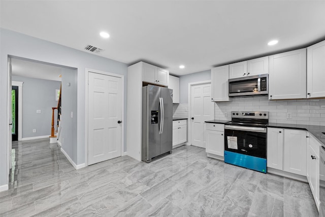 14 Still Hollow Rd, Newburgh, NY 12550 - kitchen with appliances with stainless steel finishes, tasteful backsplash, dark countertops, white cabinets, and recessed lighting