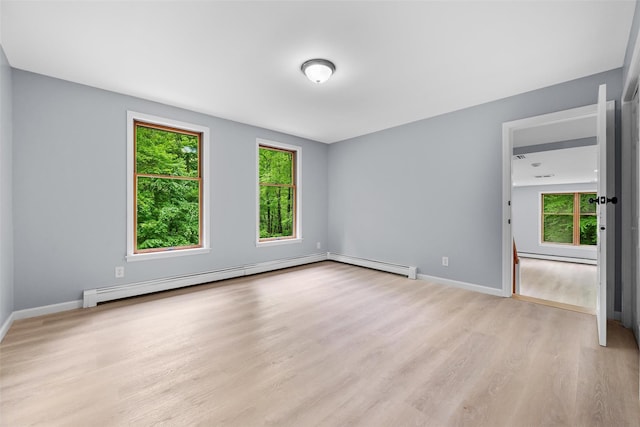 14 Still Hollow Rd, Newburgh, NY 12550 - spare room with plenty of natural light, a baseboard radiator, light wood-style floors, and baseboards
