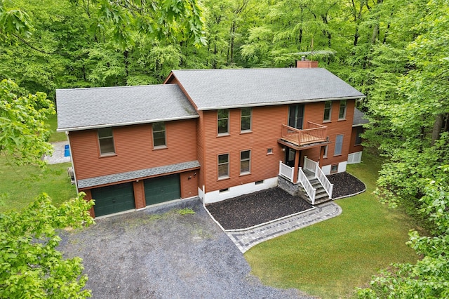 14 Still Hollow Rd, Newburgh, NY 12550 - chalet / cabin featuring a balcony, a chimney, a garage, roof with shingles, and a wooded view