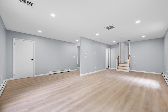 14 Still Hollow Rd, Newburgh, NY 12550 - spare room with a baseboard radiator, stairs, baseboards, light wood-style flooring, and recessed lighting