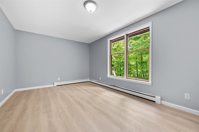 14 Still Hollow Rd, Newburgh, NY 12550 - unfurnished room with wood finished floors, baseboards, baseboard heating, and a baseboard heating unit
