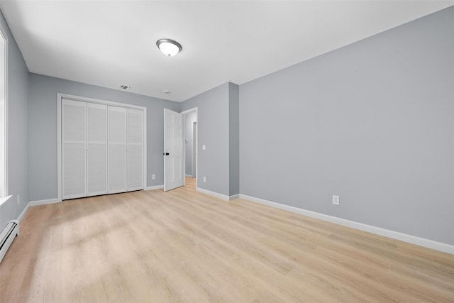 14 Still Hollow Rd, Newburgh, NY 12550 - unfurnished bedroom with baseboards, light wood-type flooring, and a closet