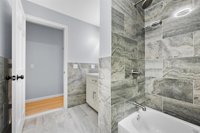 14 Still Hollow Rd, Newburgh, NY 12550 - bathroom featuring tile walls, vanity, bathtub / shower combination, wainscoting, and baseboards