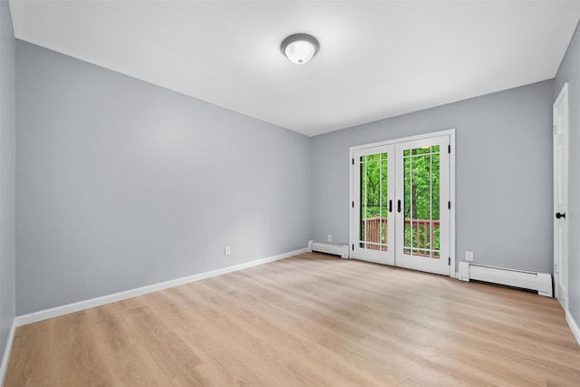 14 Still Hollow Rd, Newburgh, NY 12550 - empty room featuring baseboard heating, light wood-type flooring, french doors, and baseboards