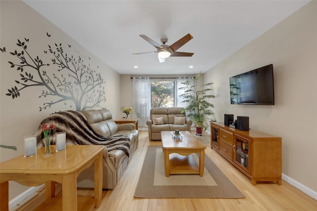 living area featuring baseboards, recessed lighting, light wood finished floors, and ceiling fan
