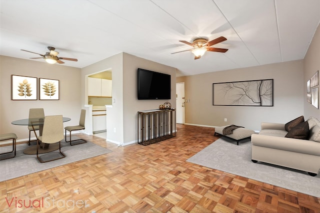 372 Central Park Ave Unit 3U, Scarsdale, NY 10583 - living room featuring ceiling fan and baseboards