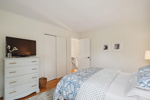 bedroom with a closet and light wood-type flooring