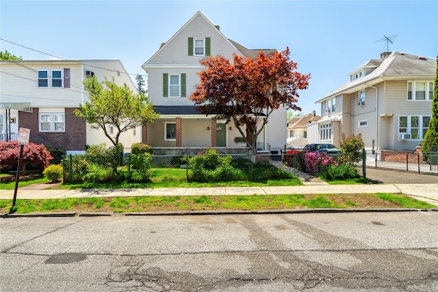 142 Primrose Ave, Mount Vernon, NY 10552 - view of front of home featuring a residential view, covered porch, a fenced front yard, and cooling unit