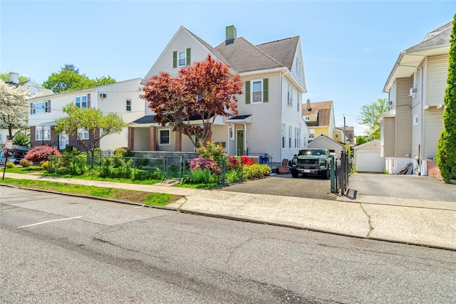 142 Primrose Ave, Mount Vernon, NY 10552 - view of front facade featuring a chimney, aphalt driveway, fence, and a residential view