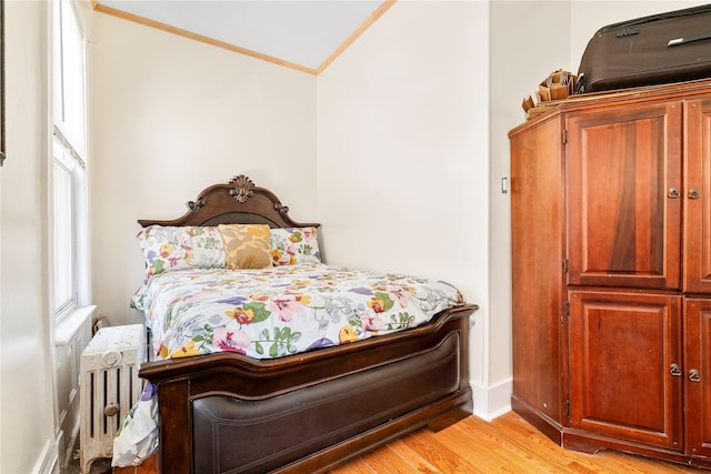 142 Primrose Ave, Mount Vernon, NY 10552 - bedroom featuring crown molding, baseboards, radiator heating unit, and light wood-style floors